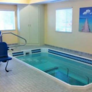 An indoor therapy pool equipped with accessibility features.