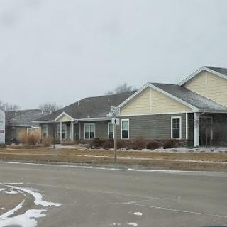 A row of single-story homes in a suburban neighborhood during winter.