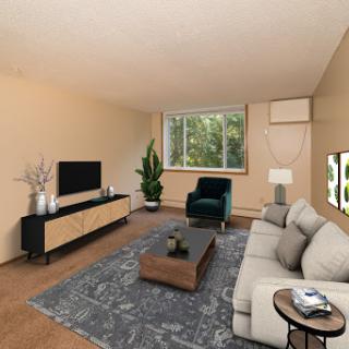 A cozy and modern living room featuring a comfortable sofa, stylish coffee table, and a serene view through the window.