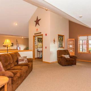 A cozy living room with comfortable seating and warm decor.