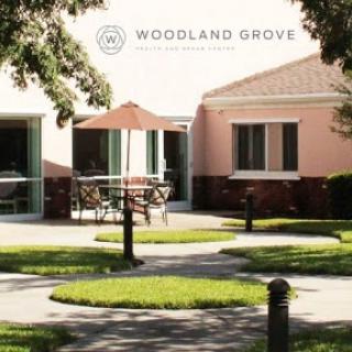 A peaceful courtyard with well-maintained gardens and elegant buildings.