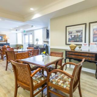 A cozy dining area with wooden furniture and pleasant decor.
