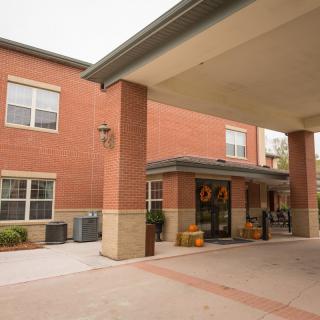 Entrance of a brick building with a covered walkway.