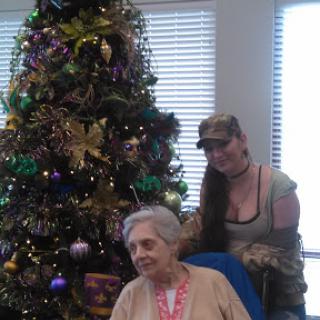 A joyful holiday moment captured with a beautifully decorated Christmas tree.