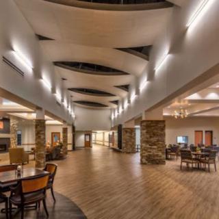 A spacious and modern lobby area with stylish lighting and furniture.