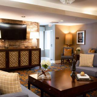 A cozy and elegantly furnished living room with a stylish decor and modern amenities.