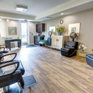 A modern salon with comfortable seating and elegant decor.