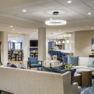 A modern lounge with comfortable seating and stylish lighting.