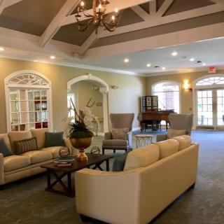 A cozy living room with comfortable seating and elegant decor.