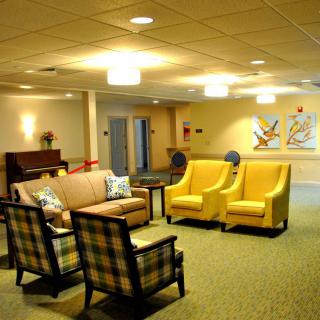 A cozy lounge area with comfortable seating and warm lighting.