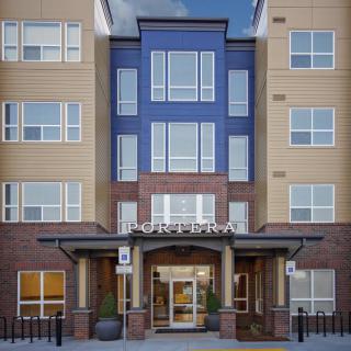 Front view of a modern apartment building entrance.