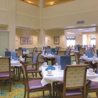 Elegant dining area with neatly set tables and comfortable chairs.