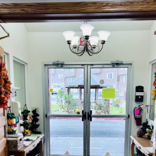 A cozy entrance with glass doors and decorative elements.