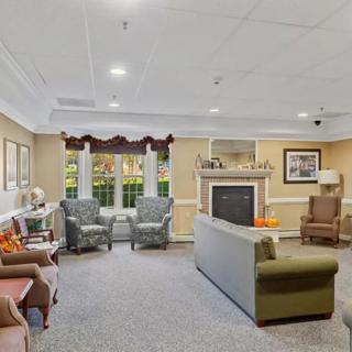 A cozy living room with comfortable seating and a fireplace.