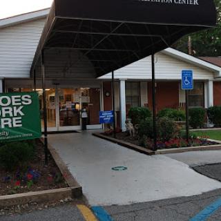 Entrance of a healthcare facility with accessible parking.