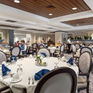 Elegant dining area with neatly arranged tables and chairs.