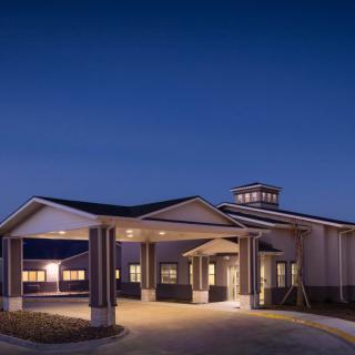 A well-lit building entrance at night.
