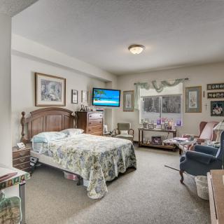 A cozy bedroom with classic furnishings and decor.