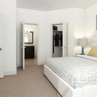 A modern and cozy bedroom featuring a neatly made bed, natural light, and minimalist decor.
