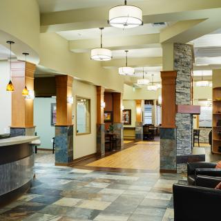 A modern reception lobby with stylish decor and comfortable seating.