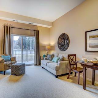 A cozy living room with comfortable seating and tasteful decor.