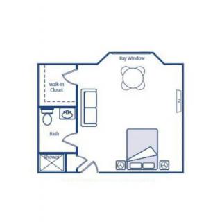 A floor plan of a studio apartment with designated areas for living room, bedroom, kitchen, and bathroom.