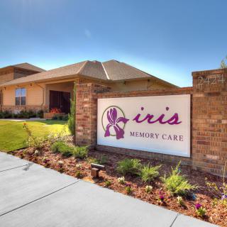 Front view of a healthcare facility with prominent signage and well-maintained landscaping.
