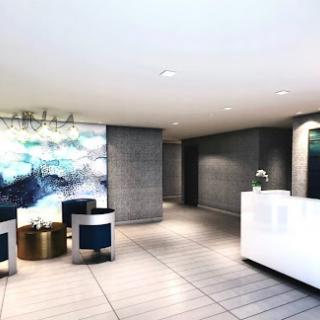 A stylish and modern hotel lobby featuring a sleek reception desk and contemporary seating arrangements.