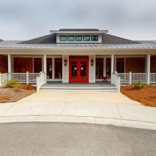 A welcoming entrance with red double doors and a spacious porch.