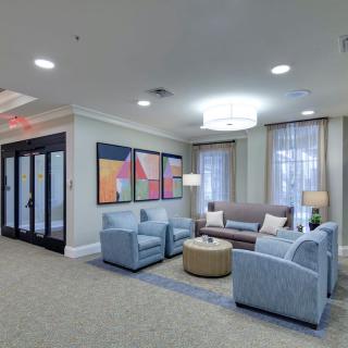 A modern lobby with comfortable seating and contemporary artwork.