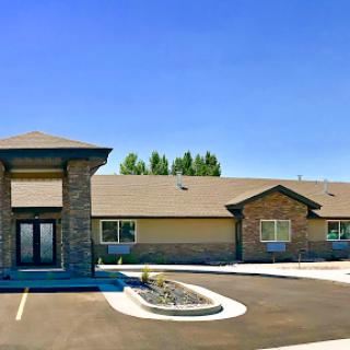 A modern commercial building with a well-designed exterior on a clear sunny day.