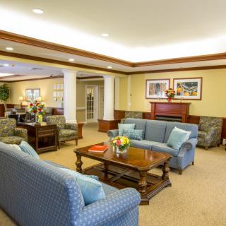 A cozy living room with sofas and a coffee table, showcasing elegant interior design.