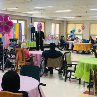 Residents enjoy an engaging performance at a community center event.