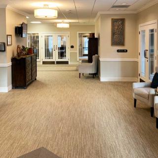 A well-lit lobby area with comfortable seating and elegant decor.