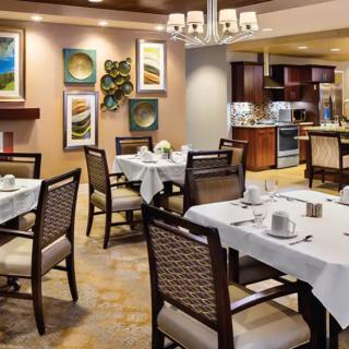 A well-decorated restaurant dining area with neatly arranged tables and chairs.