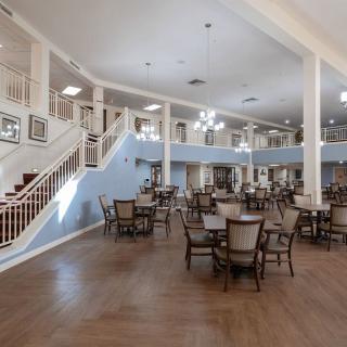 Spacious dining area with elegant interior design and ample seating.