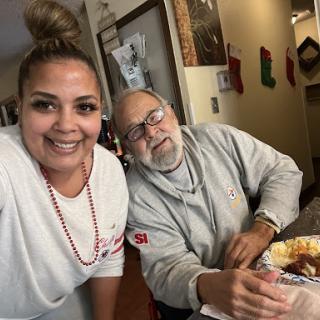 A joyful moment shared over a meal with loved ones.