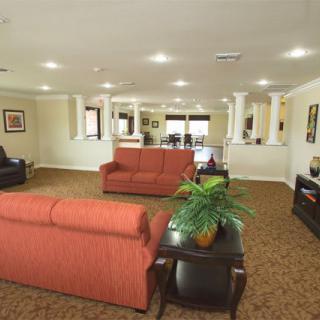 A spacious living room with comfortable sofas and elegant decor.
