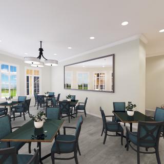 A modern and bright dining area with neatly arranged tables and chairs, featuring elegant lighting and decor.