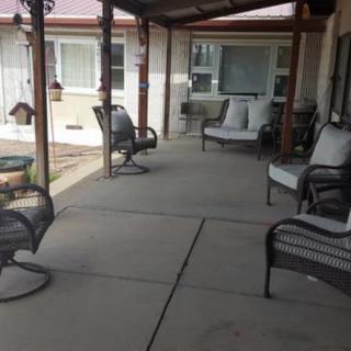 A cozy outdoor patio with comfortable seating arrangements.