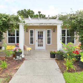 A charming house with a garden and welcoming entrance.
