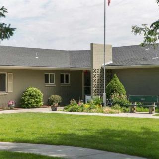A modern residential house with a well-maintained lawn and garden.