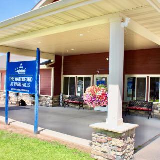 Entrance to a vacation rental building with a welcoming sign.
