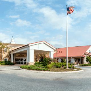 A welcoming entrance to a hospitality facility showcasing an American flag.