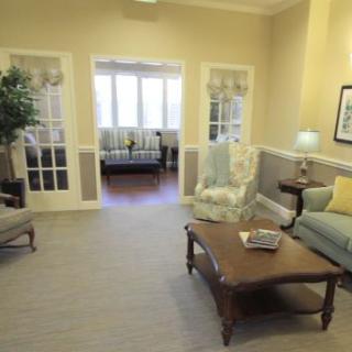 A cozy living room with comfortable seating and soft lighting.