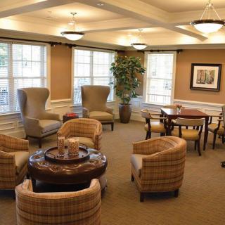 A cozy lounge area with comfortable seating and soft lighting, perfect for relaxation.