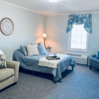 A cozy living room with comfortable seating and a soft color palette.