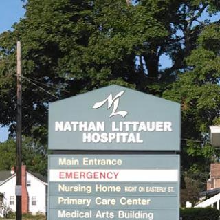Sign outside Nathan Littauer Hospital indicating various services including emergency care.
