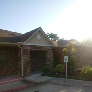A sunny view of a brick residential building.