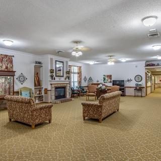 A cozy living room with comfortable seating and a fireplace.